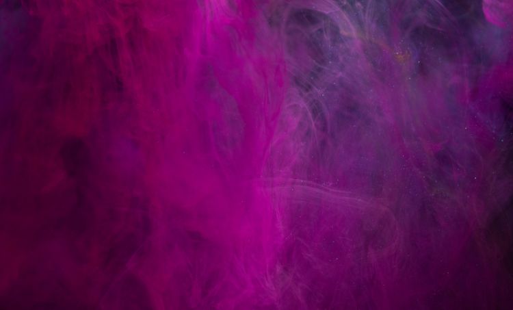 Thick cloud of vibrant pink and purple smoke swirling against a dark background.