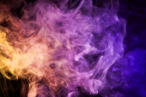Swirling colorful smoke in shades of yellow, pink, purple, and blue against a dark background.